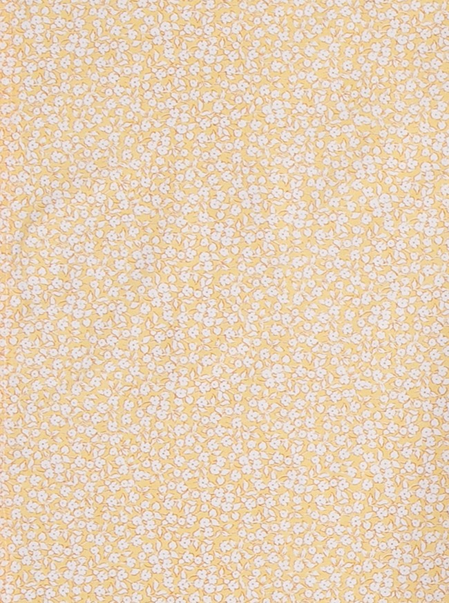 Coussin d'allaitement jaune à fleurs blanches