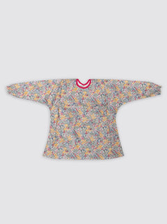 Baby smock with pocket, mimosa flowers, pink bias binding