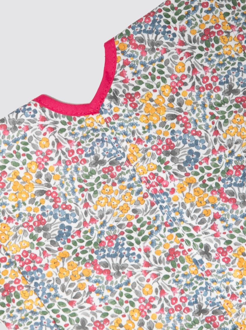 Baby smock with pocket, mimosa flowers, pink bias binding