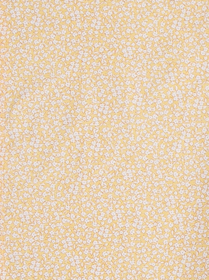 Coussin d'allaitement jaune à fleurs blanches