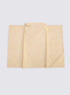 Bavoir jaune à fleurs blanches