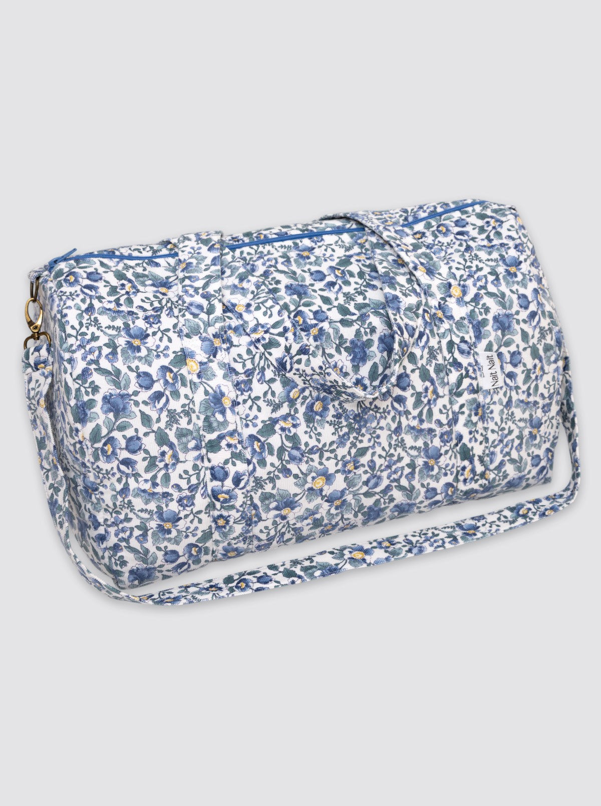 Sac de voyage en velours côtelé bleu à fleurs